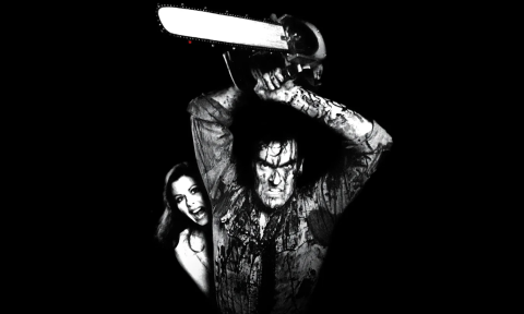 Ash Williams is covered in blood and lifts a chainsaw above his head. 